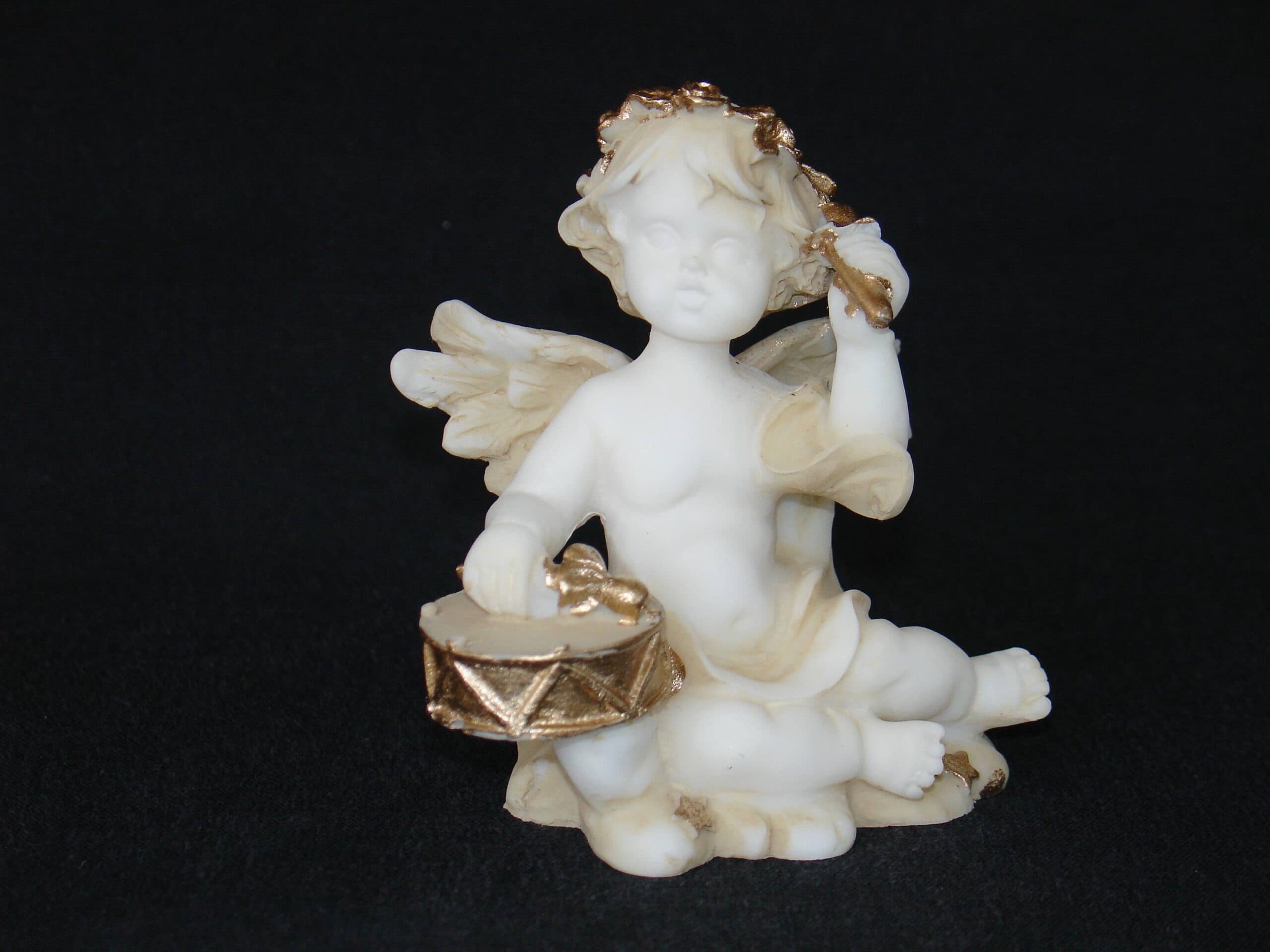 Angel playing drums statue