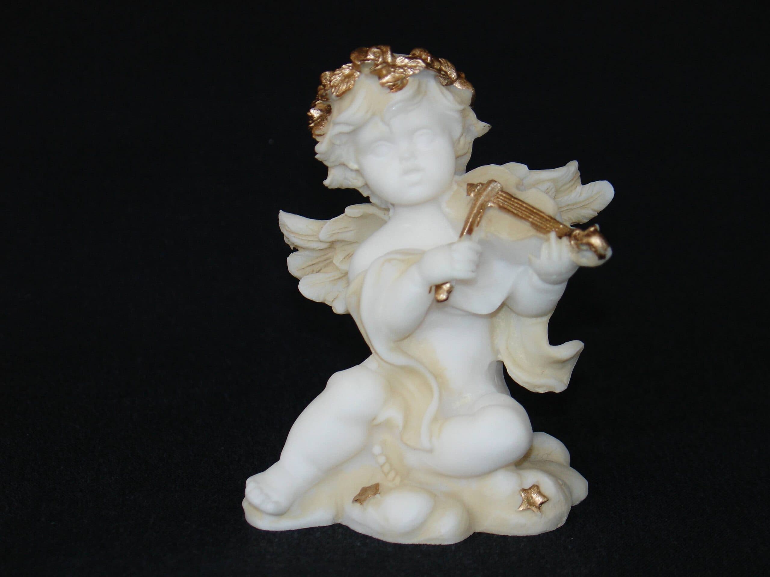 Angel playing violin statue