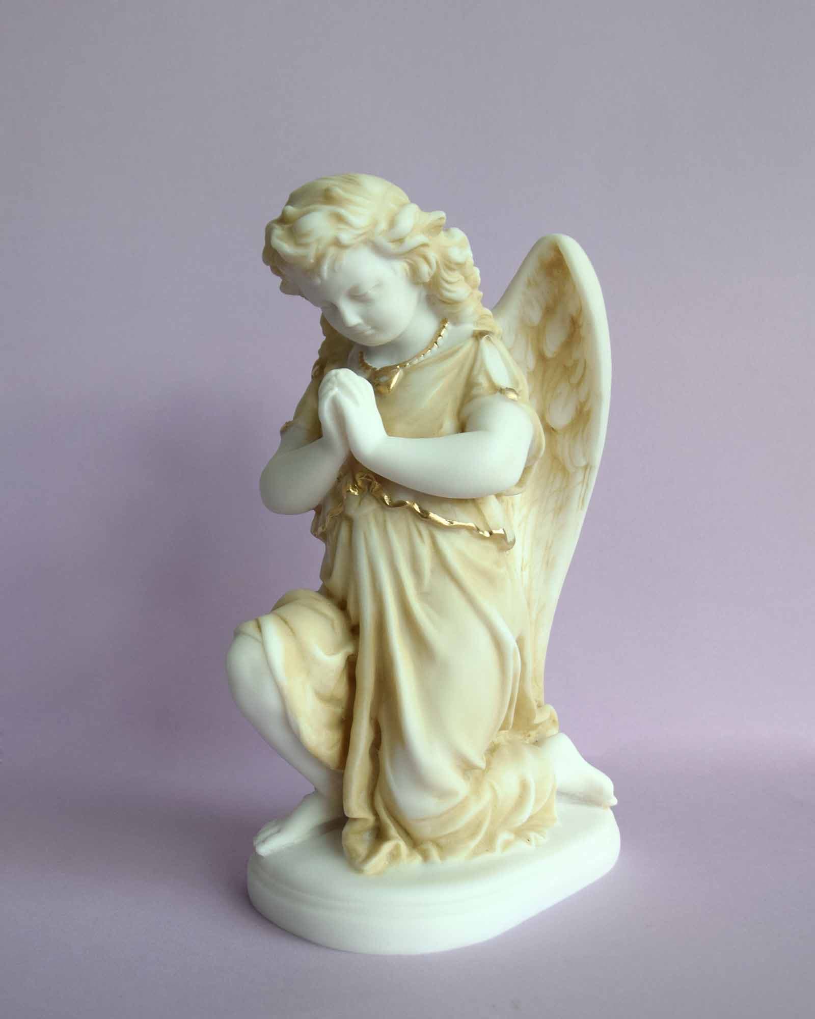 Angel praying on its knee