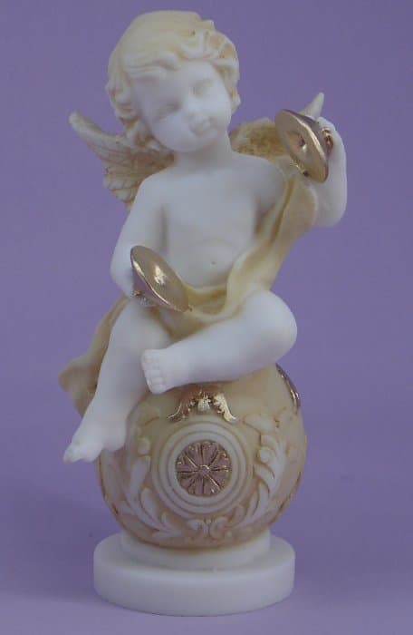 Angel playing cymbals statue