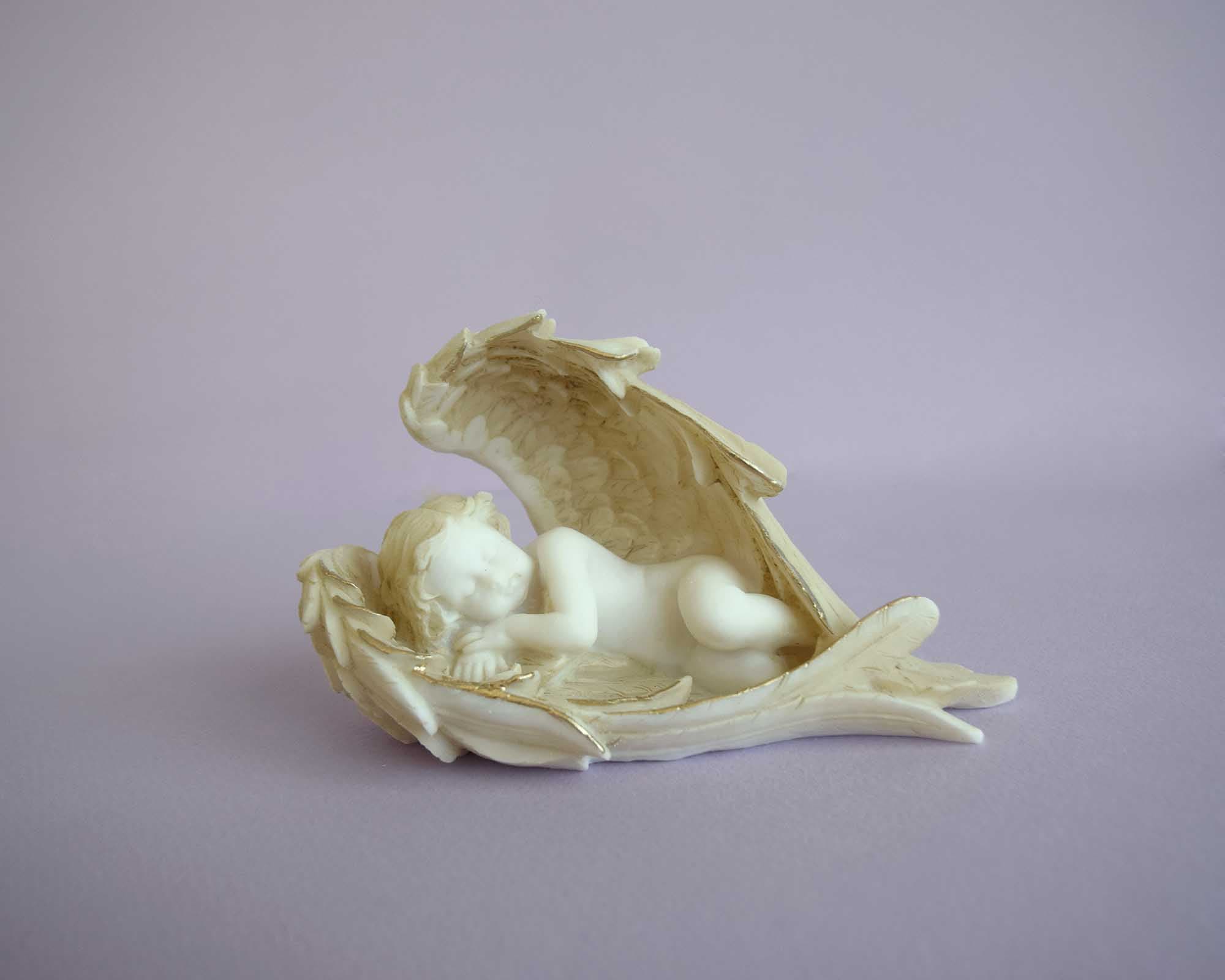 Angel sleeping left view statue