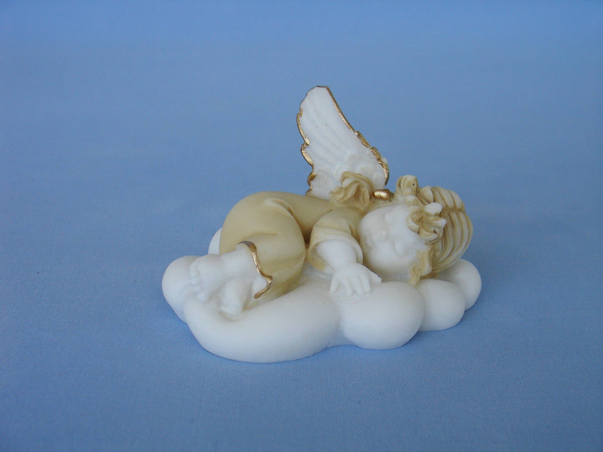Angel sleeps on a cloud statue
