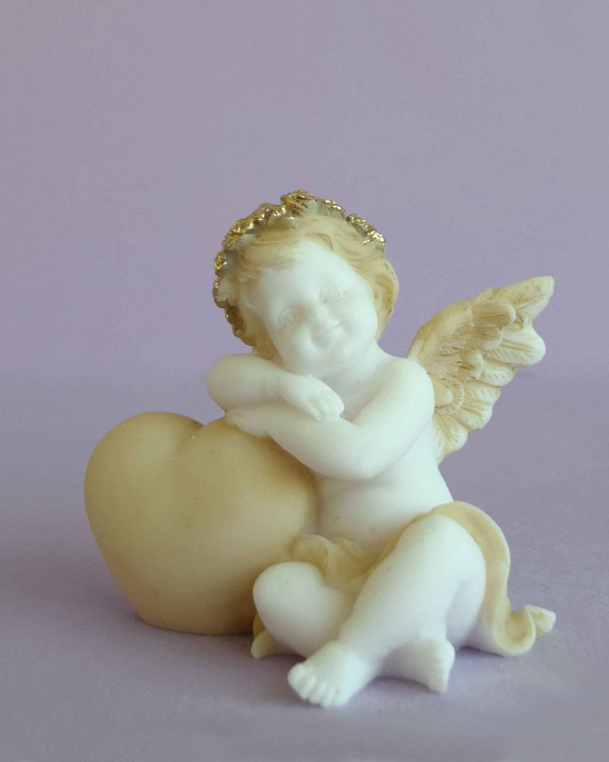 Angel with a heart left view statue