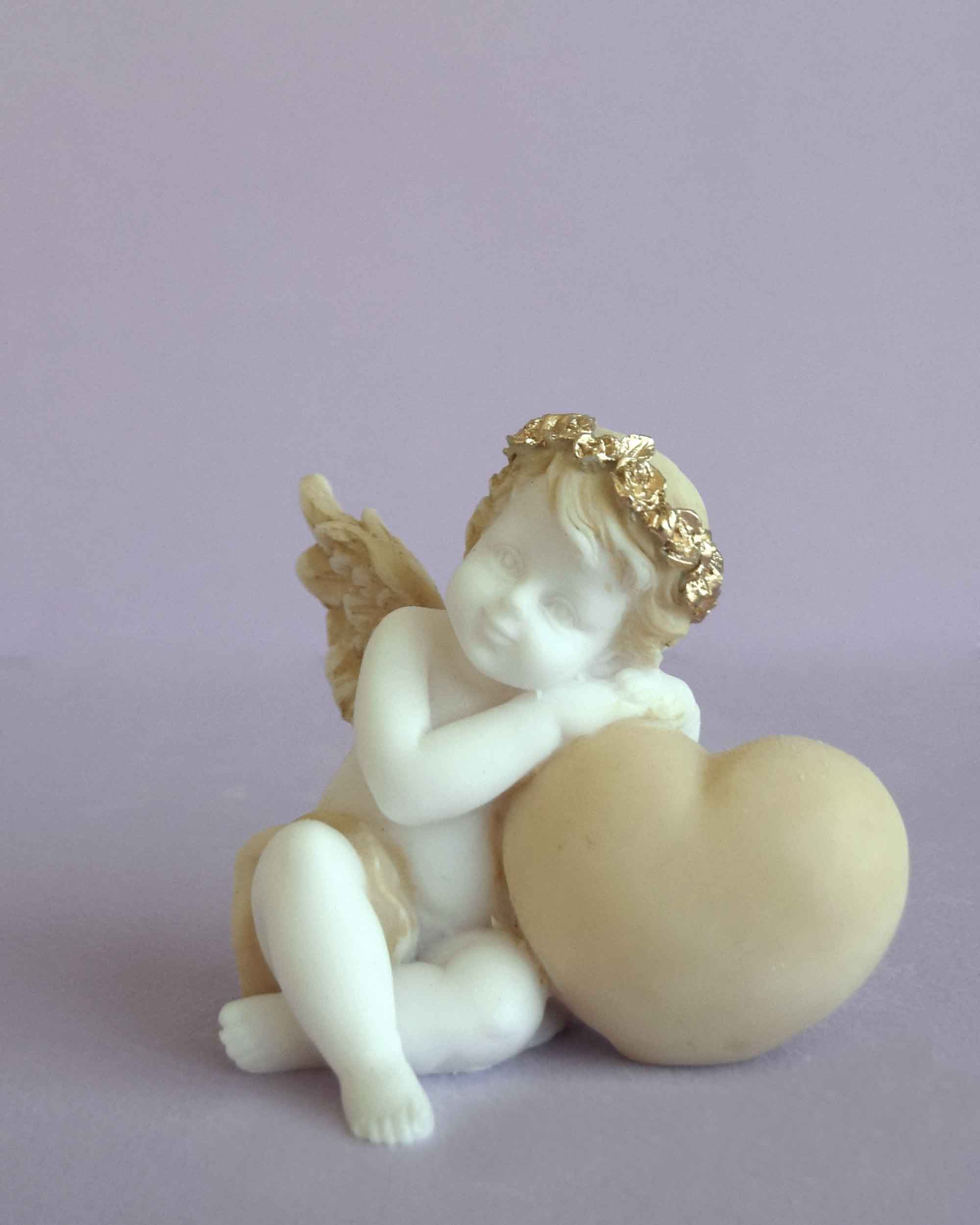 Angel with a heart right view statue