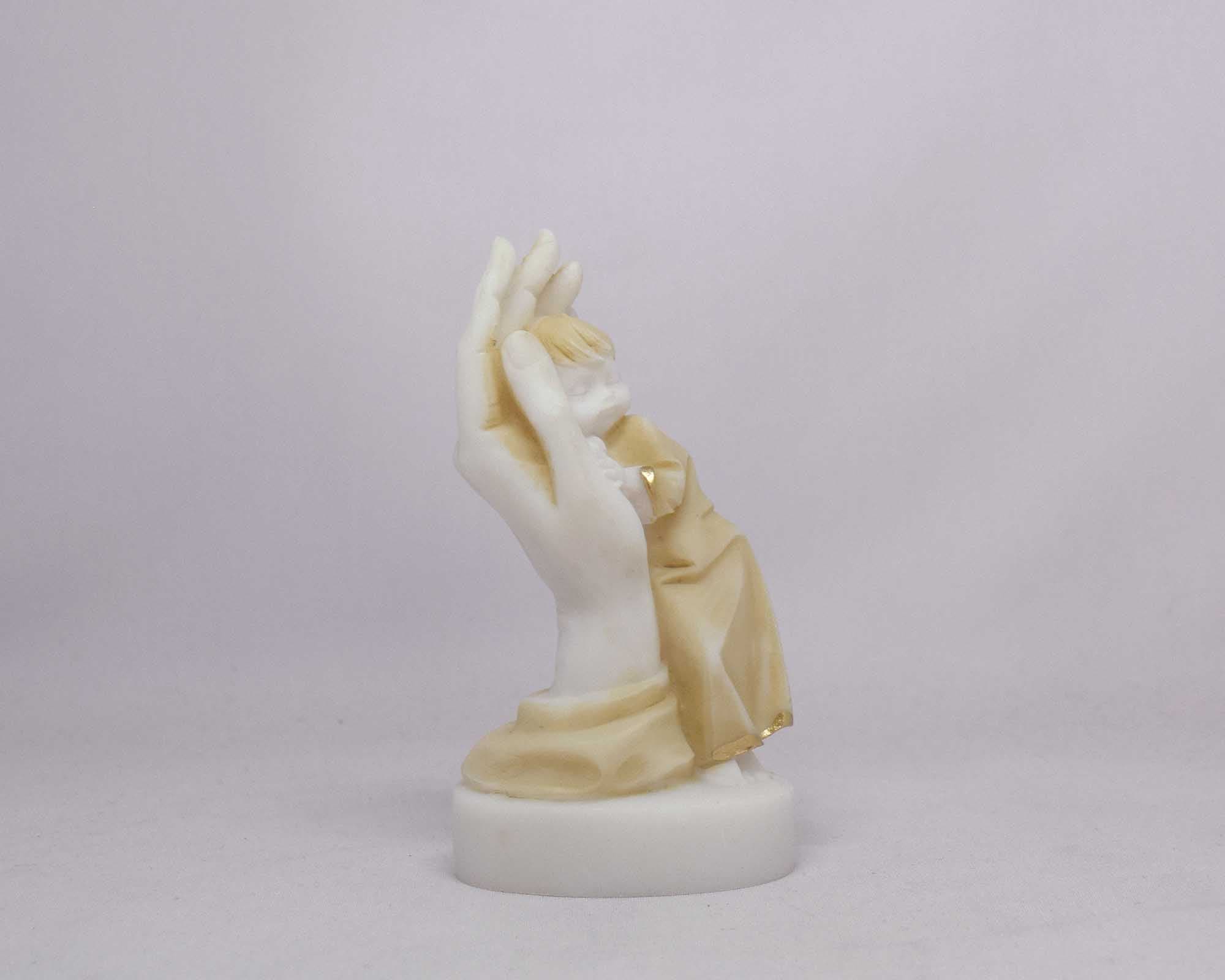 Boy in hand statue