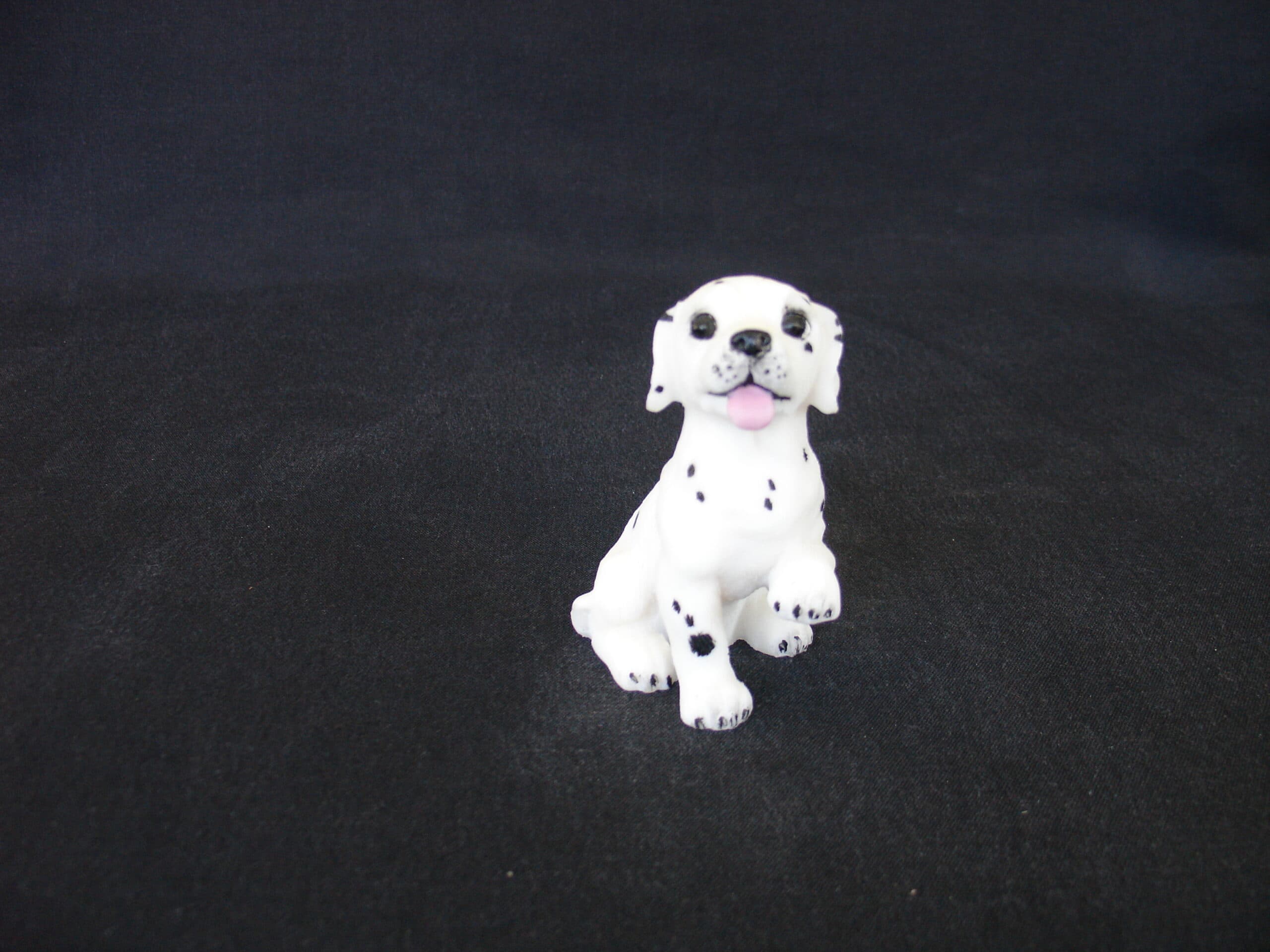 Dalmatian baby pet dog statue sitting on the floor