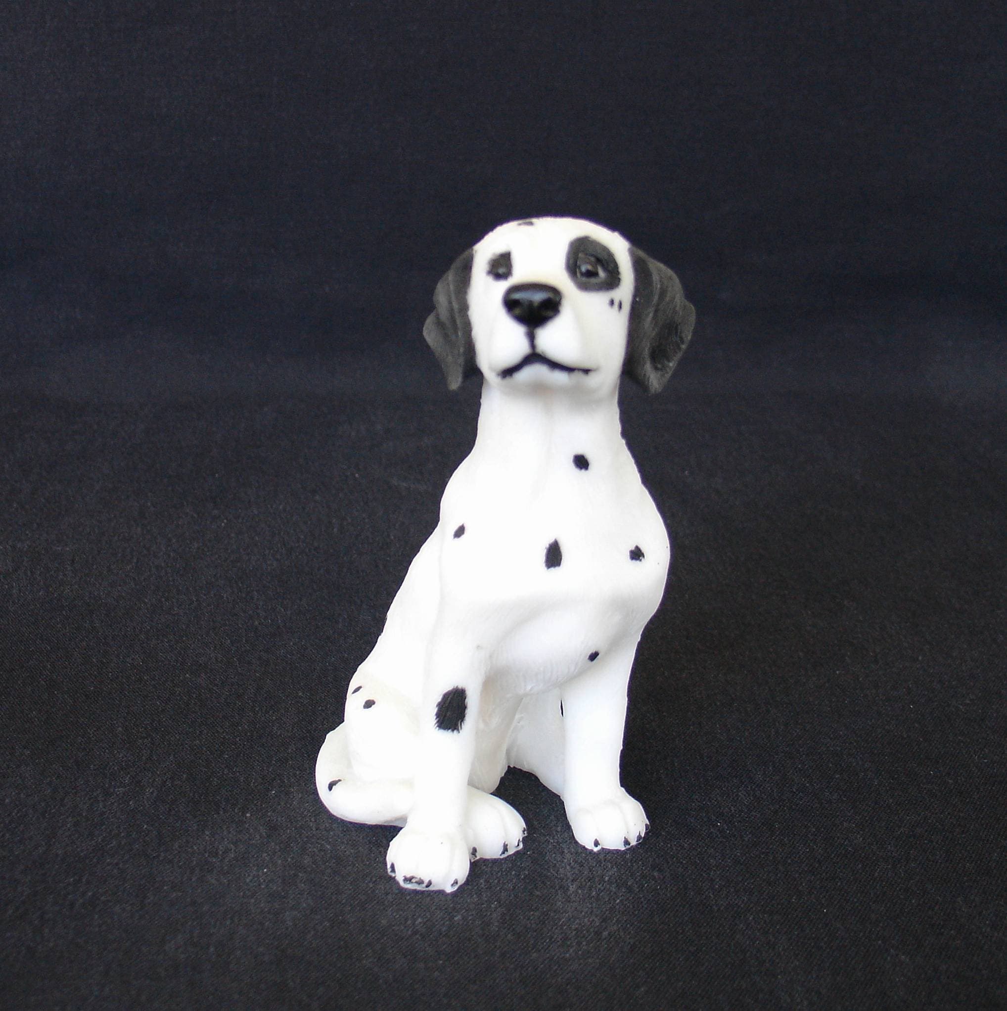 Dalmatian pet dog statue sitting on the floor
