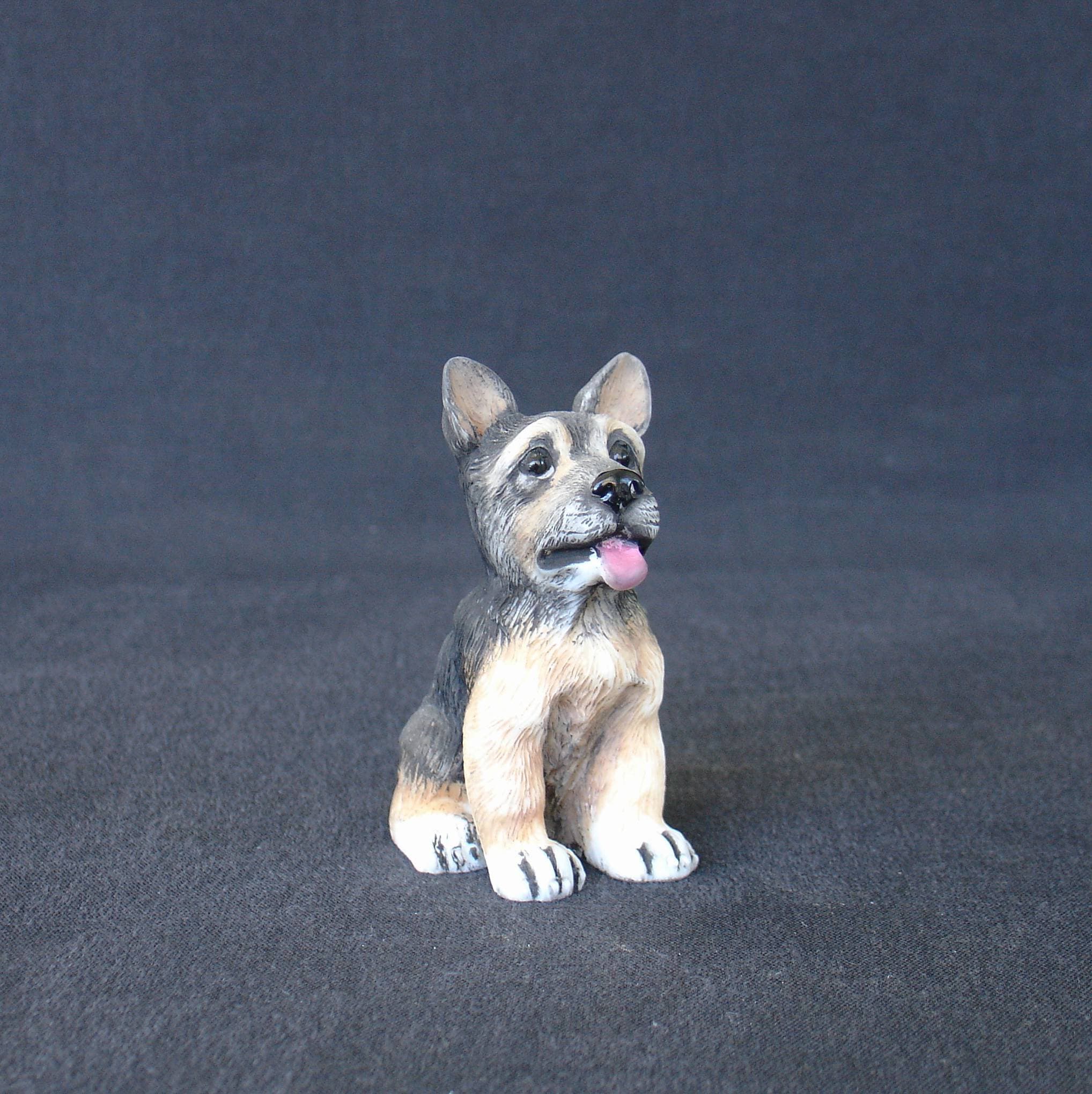 German Shepherd baby pet dog statue sitting on the floor