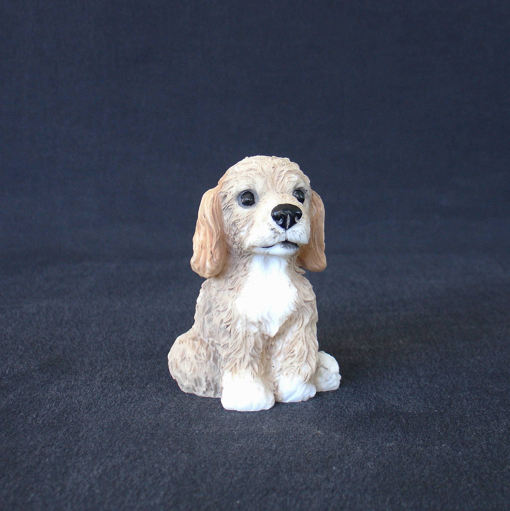 Poodle pet dog statue sitting on the floor