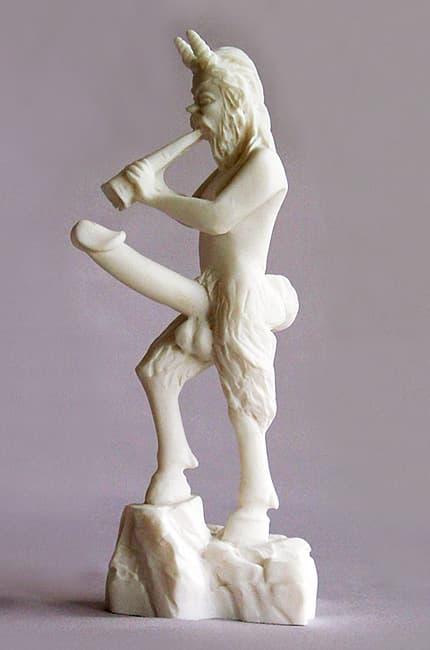Satyr statue playing music
