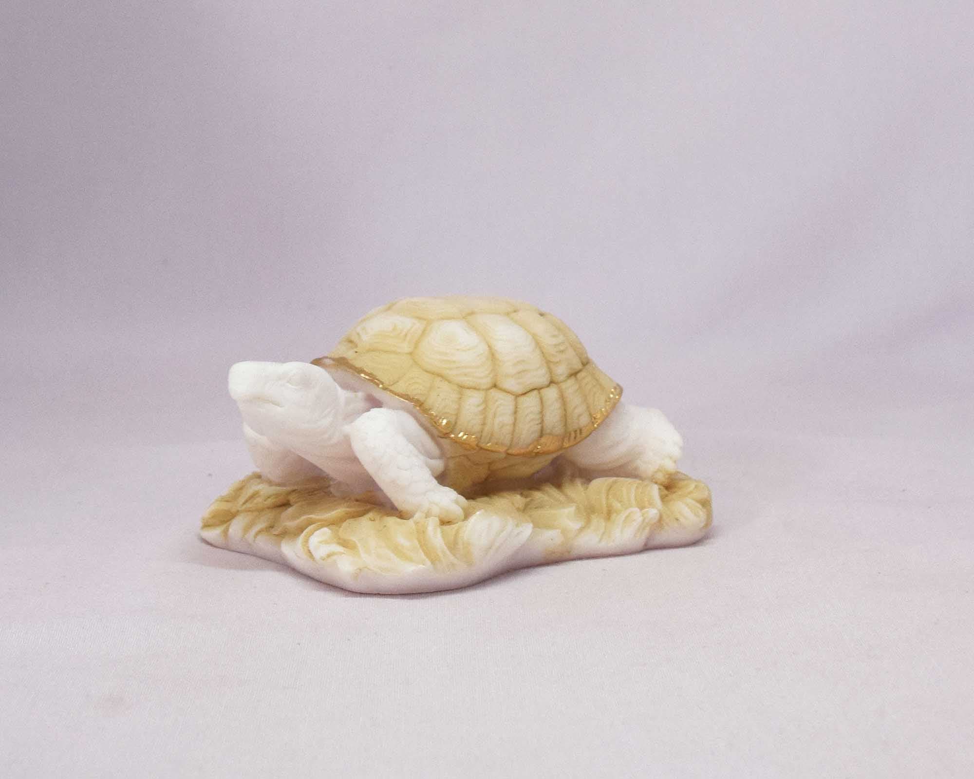 Turtle statue on sand